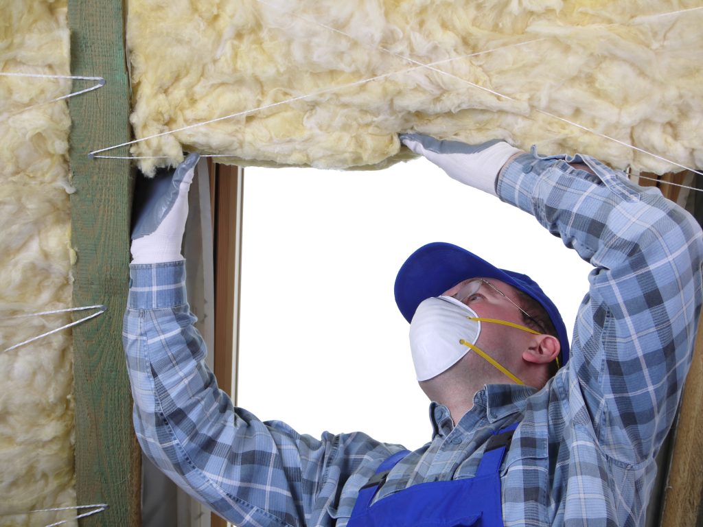 a person installing insulation